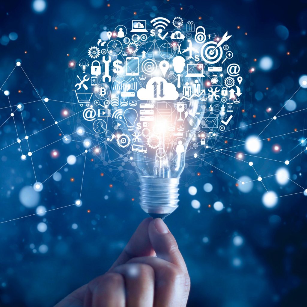 Hand holding light bulb and business digital marketing innovation technology icons on network connection, blue background